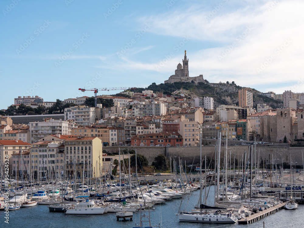 View on the old port in Marseille, in Provence, in the south of France. Notre-dame de la Garde church in the background.