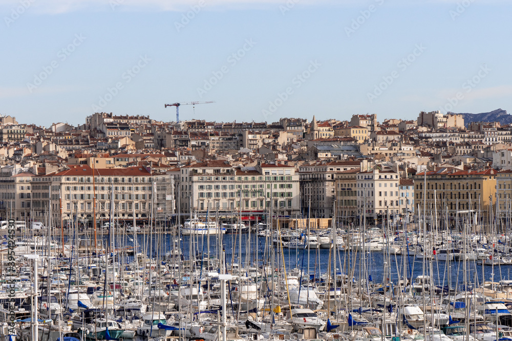 View on the port of the old city of Marseille, in the south of France. Sunny. The city is located on the Mediterranean coast near the mouth of the Rhône. 