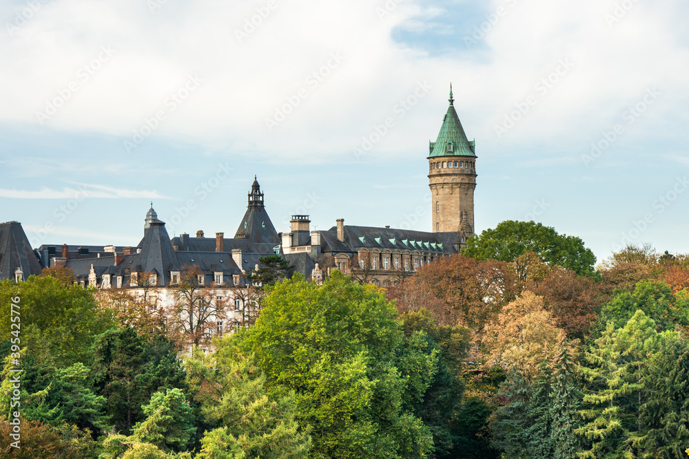 Bank museum in the city of Luxembourg. Trees are in the foreground. Photographed during autumn. A few clouds in the sky.