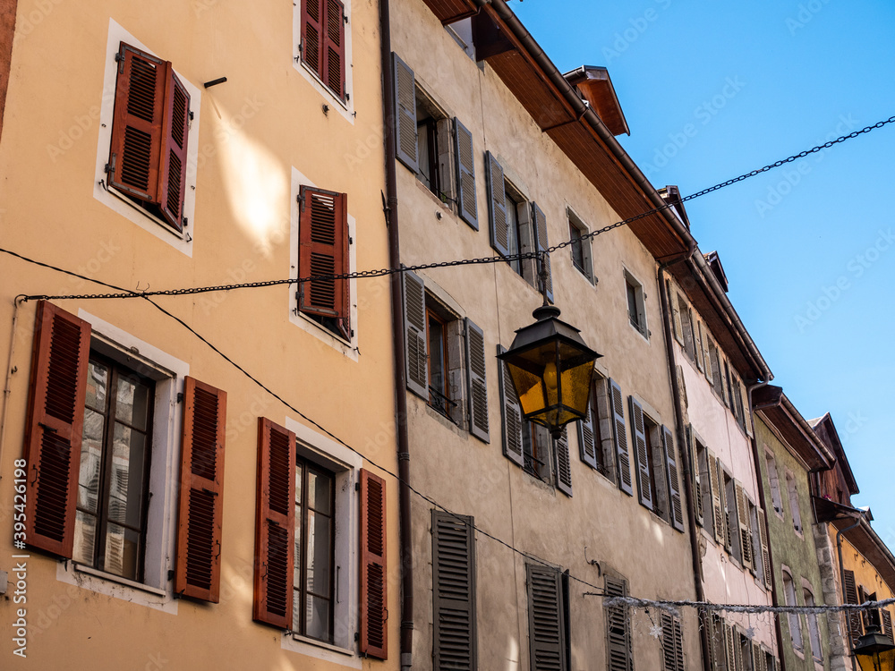 View on the facades of the old town of Annecy, in Haute-Savoie. The houses are colorful. The sky is blue, sunny day.