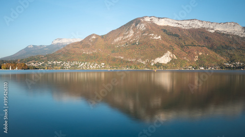 View on the famous lake of Annecy, a city located in Savoie, France. Reflection on the water. Sunny day, autumn. 