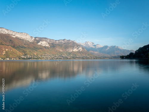 Landscape in Annecy, Savoie, France. In the autumn, view on the lake, daylight, blue sky and reflection.