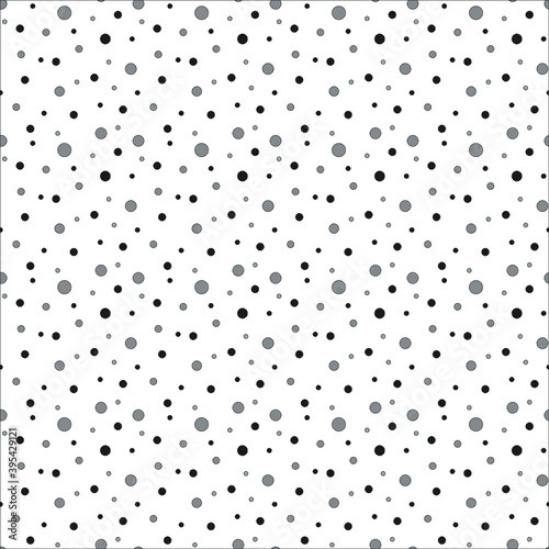 grey polkadot background with black and dark grey dots