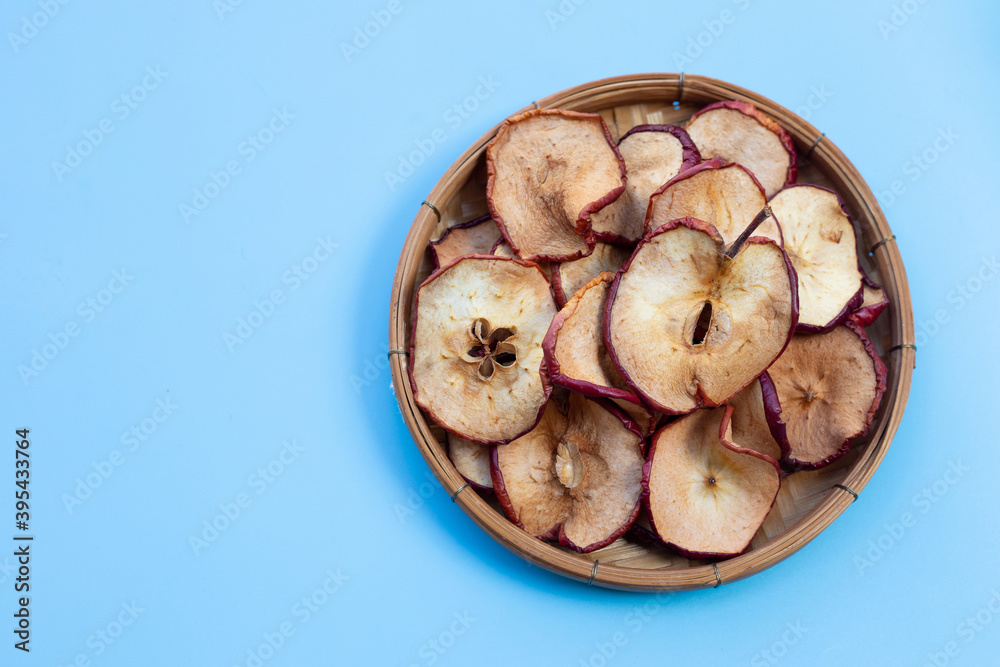 Dried apple slices on blue background Dried apple slices on blue background