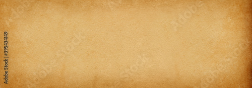 Old brown paper banner background with vintage spots