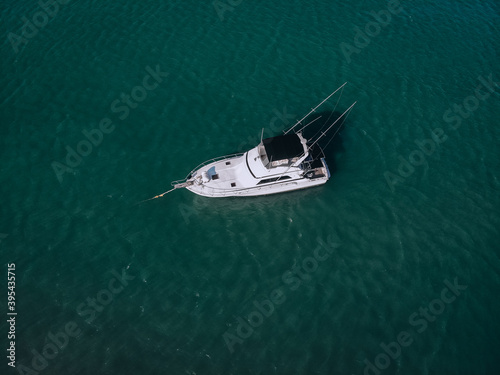aerial View Of   little yacht with black sail  At The Andaman sea. Phuket. Thailand © Semachkovsky 