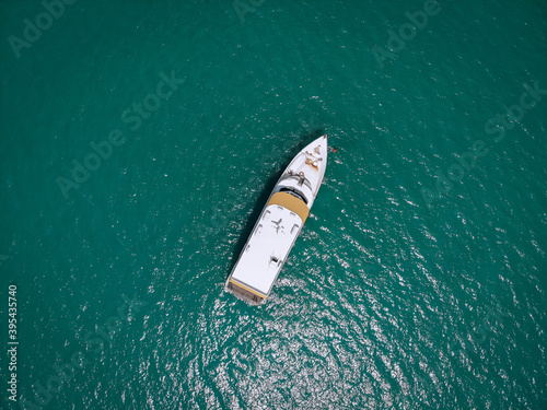 Aerial picture of an isolated yacht with brown wooden design in the sea. Andaman sea © Semachkovsky 