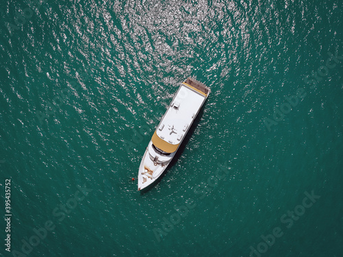 Aerial picture of an isolated yacht with brown wooden design in the sea. Andaman sea © Semachkovsky 