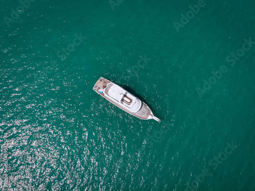 Aerial picture of an isolated yacht with brown wooden design in the sea. Andaman sea