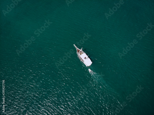 Aerial picture of an isolated yacht with brown wooden design in the sea © Semachkovsky 
