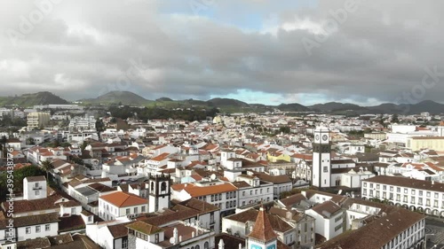 Ponta Delgada cityscape in an overcast day in São Miguel Island, Azores, Portugal - High angle Orbit Aerial