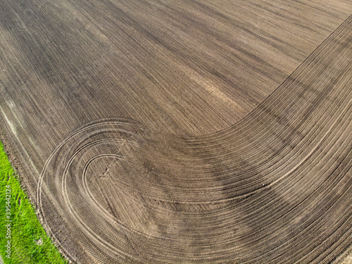 plowed agricultural crop field on which there were traces of the transported vehicles during the processing of the field