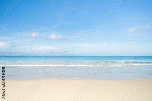 Beautiful beach in Phuket against tiny clouds sky background.