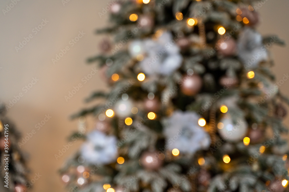 Decorated Christmas tree in blur, background for Christmas pictures. The concept of Christmas holidays, holidays. Decorated Christmas tree in blur, background for Christmas pictures. The concept of Christmas holidays, holidays.