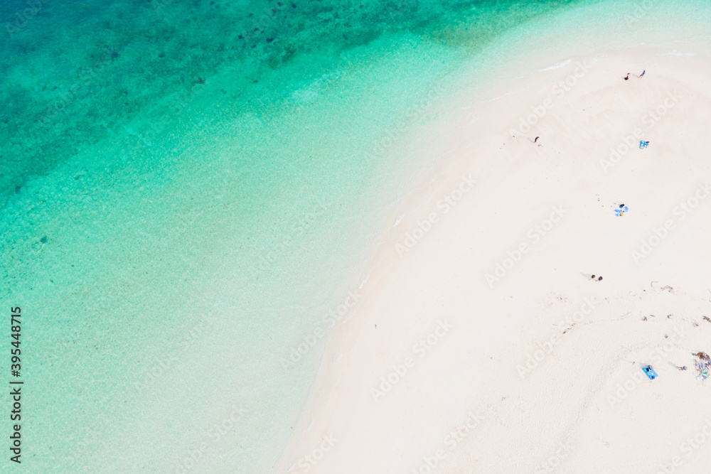 Aerial view of drone. Beaches and shops for food and beverage services on Khai Island, Phuket, Thailand, Seawater clear and blue green. Nature in Khai Island. At Khai island, Phuket, Thailand.