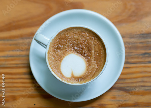 cup of coffee on wooden table