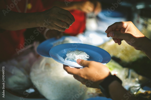 Volunteers Share Food to the Poor: concept of poverty in Asian society