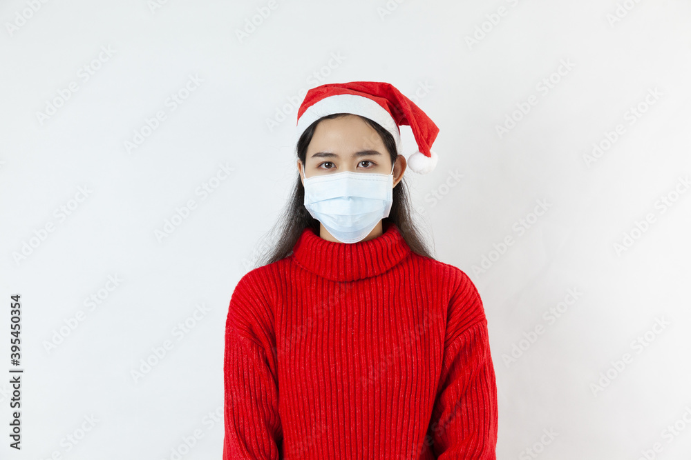 A beautiful, calm Asian woman with a protective mask, looks at the camera on white background A beautiful, calm Asian woman with a protective mask, looks at the camera on white background