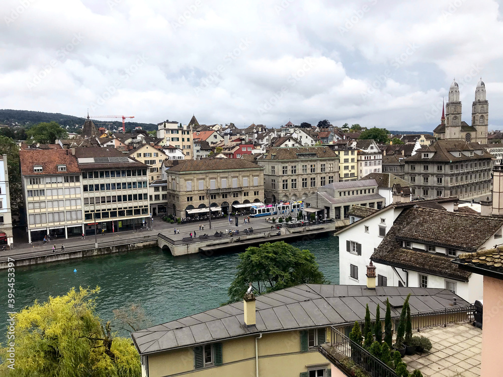 view of the Grossmunster church near river in Zurich, Switzerland, Swiss