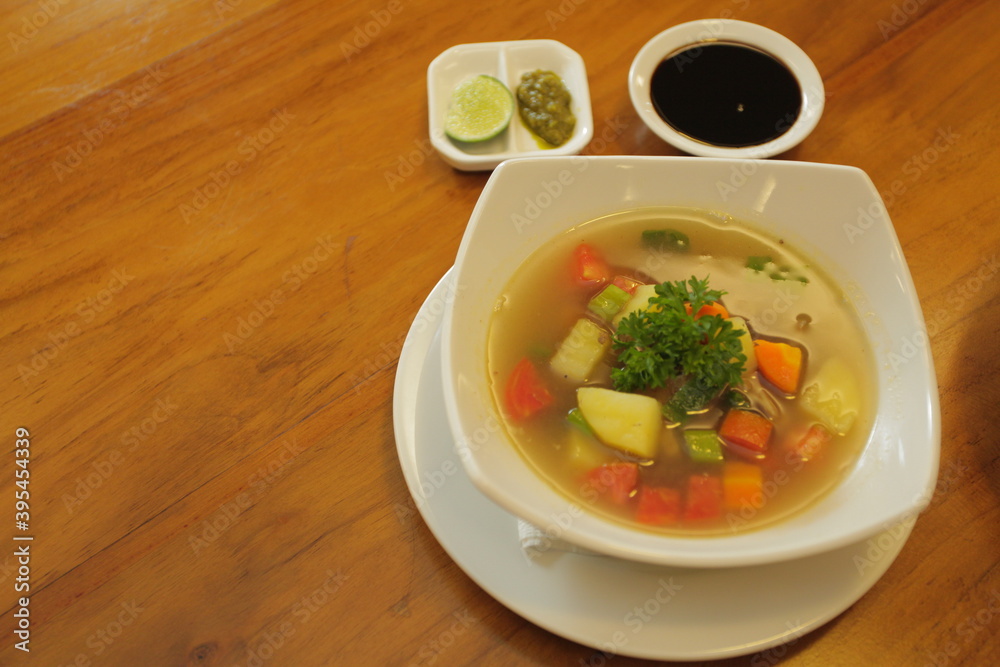 Beef oxtail soup with emping crackers Beef oxtail soup with emping crackers