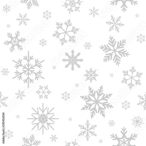 Winter seamless pattern with flat silver grey snowflakes on white background.