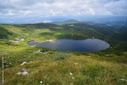 Fototapeta Naklejka Na Ścianę i Meble -  Wielky Staw is a glacial lake in Karkonosze, Giant Mountains, Poland, with beautiful mountains surrounding it.
