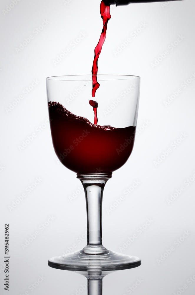 Red wine being poured into a glass Red wine being poured into a glass