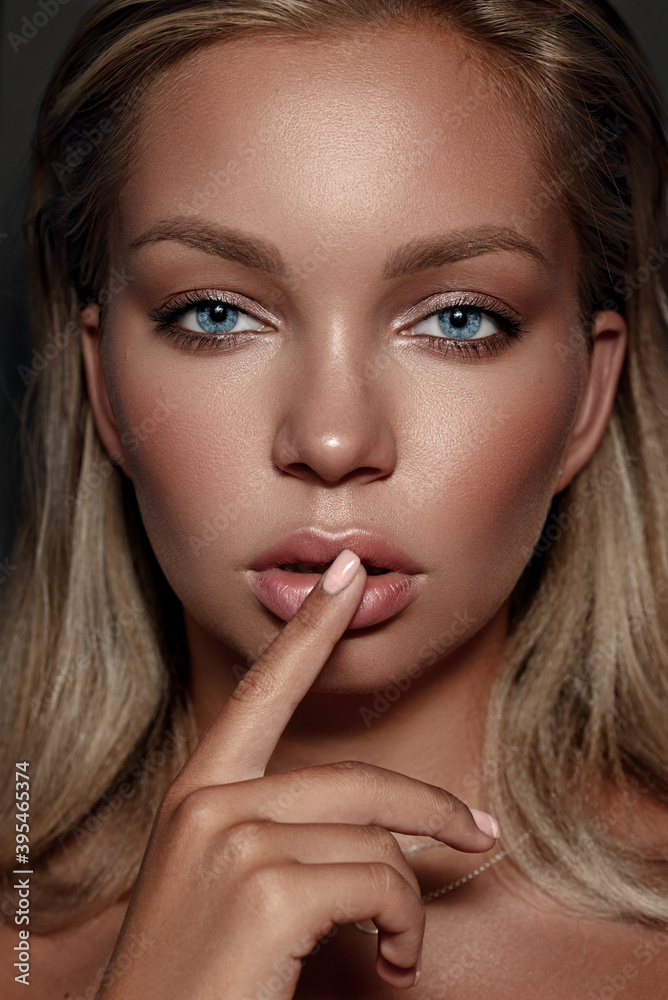 Close-up portrait of a beautiful woman with blue eyes . Strong skin texture. Natural makeup, clean healthy skin. Eyebrows. Eyes. Puffy lips. Close-up portrait of a beautiful woman with blue eyes . Strong skin texture. Natural makeup, clean healthy skin. Eyebrows. Eyes. Puffy lips.