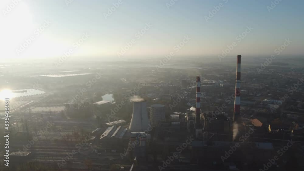 Aerial view of a thermal power plant. Cogeneration plant. Industrial heat supply for a big city. Aerial view of a thermal power plant. Cogeneration plant. Industrial heat supply for a big city.
