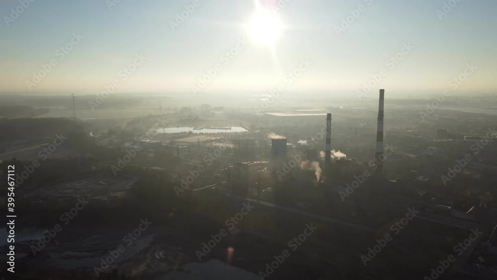 Epic shot on high smoke chimneys. The pipes do not smoke, but they pollute the atmosphere. Industrial pollution, chimney fumes. Industrial zone, streaks of smoke. Climate change, ecology. Epic shot on high smoke chimneys. The pipes do not smoke, but they pollute the atmosphere. Industrial pollution, chimney fumes. Industrial zone, streaks of smoke. Climate change, ecology.