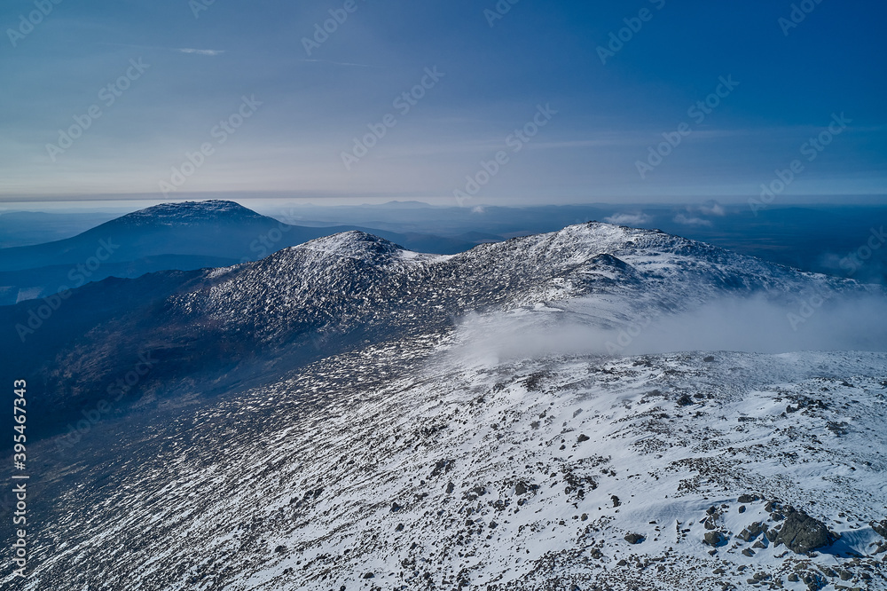 Obraz premium Snow-capped mountains in clouds Beautiful mountain peaks
