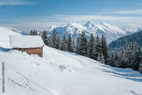 Landscape with chalet house of Zillertal Arena ski resort in Tyrol in Mayrhofen in Austria in winter Alps. Penken ski area. Mountains and fir trees covered with snow. Frosty morning