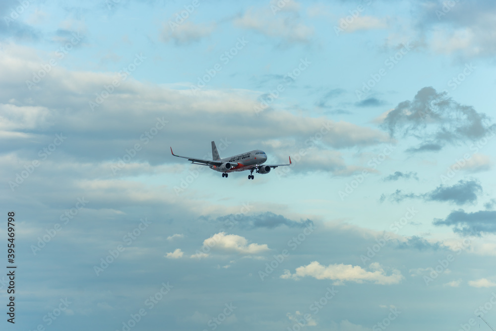 Jetstar Airways Airbus A320 fly over urban areas preparing landing into ...