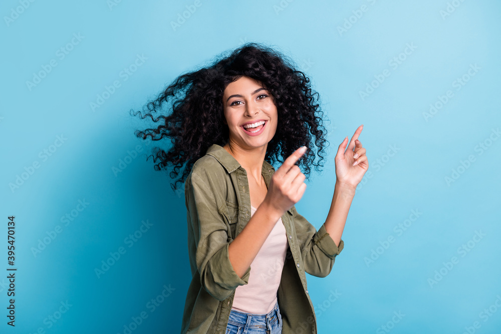 Portrait of charming cheerful lady have fun dancing hair flying good mood toothy smile isolated on blue color background Portrait of charming cheerful lady have fun dancing hair flying good mood toothy smile isolated on blue color background