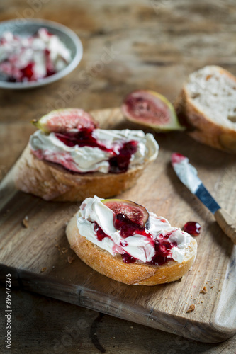Baguette with goat's cheese and fig jam photo