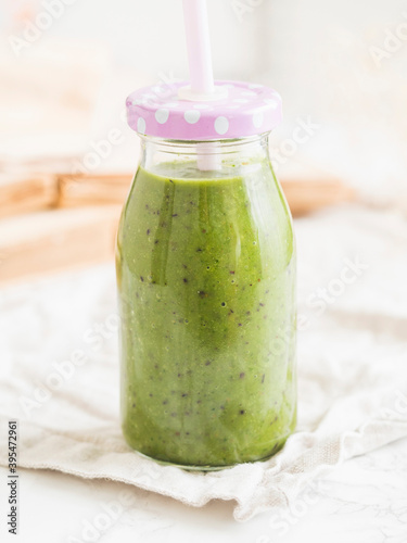 Green vegan smoothie in a bottle photo