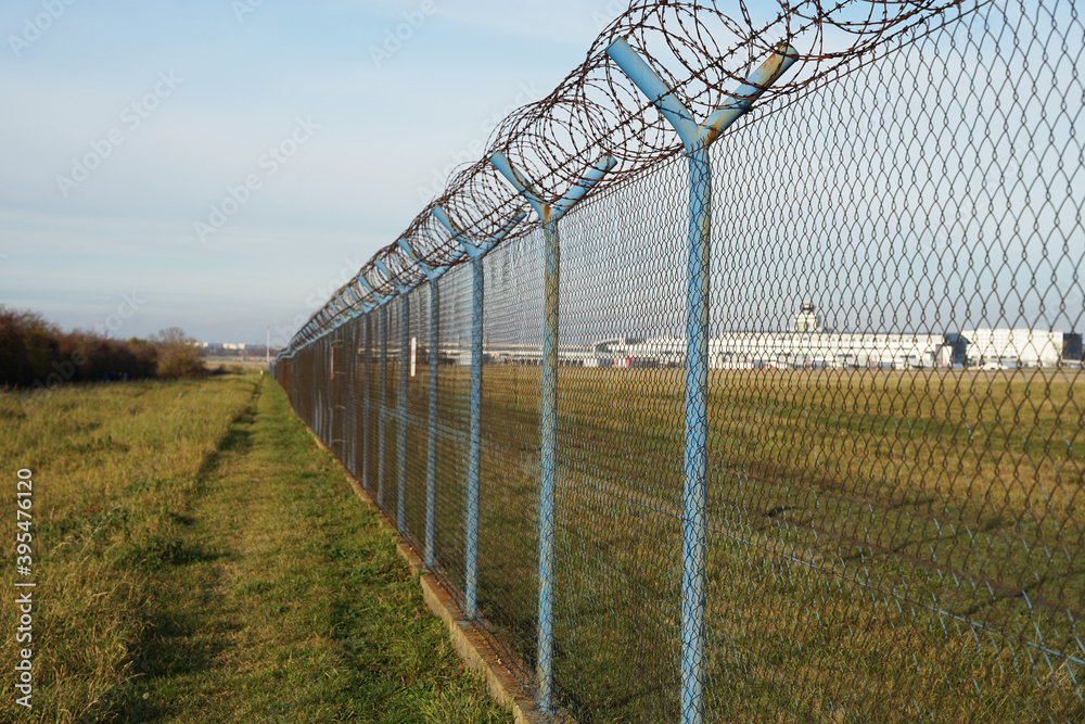 Airport security perimeter fencing system with razor wire, Prague, Czech Republic
