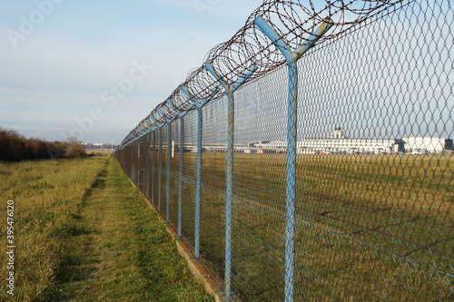 Airport security perimeter fencing system with razor wire, Prague, Czech Republic