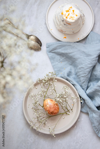 Traditional Russian and Ukraine curd Easter cake with candied and Easter Eggs, Naturally Dyed with Onion Skins, Flowers and Herbs photo