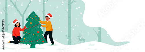 Happiness Boy And Girl Decorated Xmas Tree Together On Snowfall Forest Background For Christmas Festival.