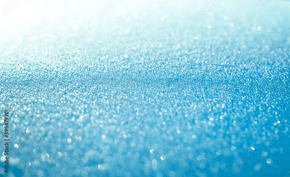 Obraz premium Blue snow sparkling festive background. Abstract Christmas for card or invitation.