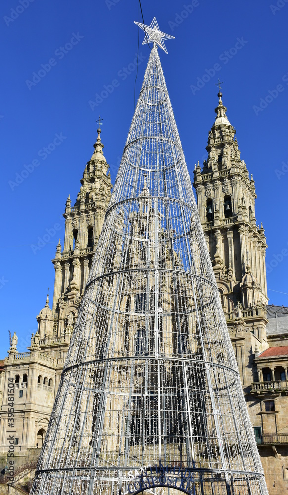 Cathedral, facade view from Praza do Obradoiro with blue sky and Christmas tree. Santiago de Compostela, Galicia, Spain, Europe.