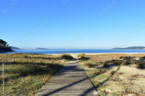 Beach with wooden boardwalk at famous Rias Baixas Region. Muxia  Coru  a  Galicia  Spain. 