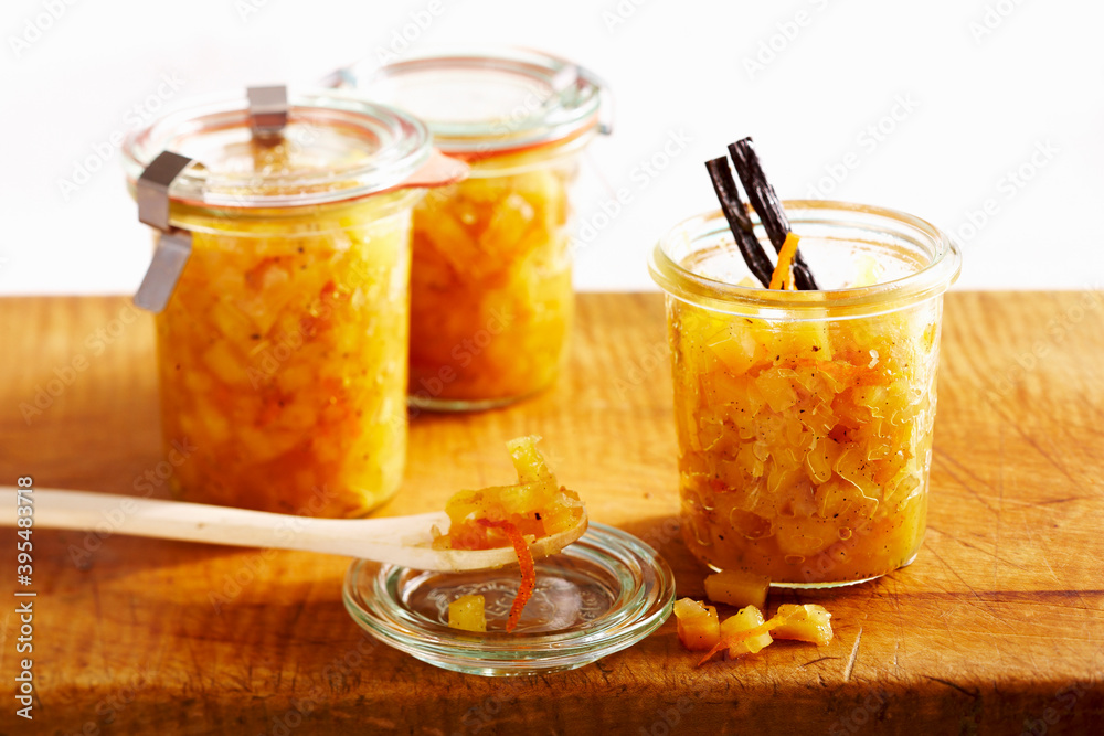 Preserved quince chutney with oranges, vanilla and Malabar pepper in mason jars Preserved quince chutney with oranges, vanilla and Malabar pepper in mason jars