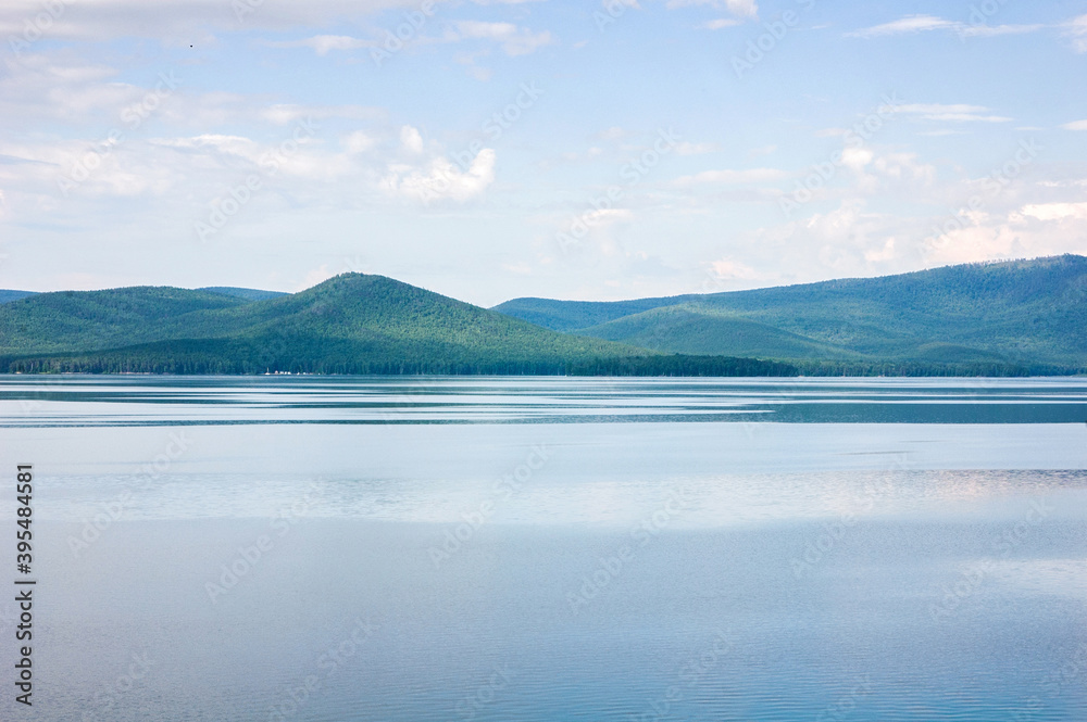 View of green hills on Turgoyak lakeside in Ural