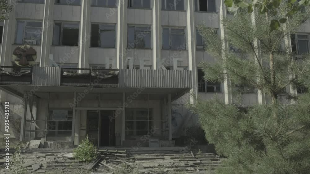 Tilt down derelict office block in Pripyat 
