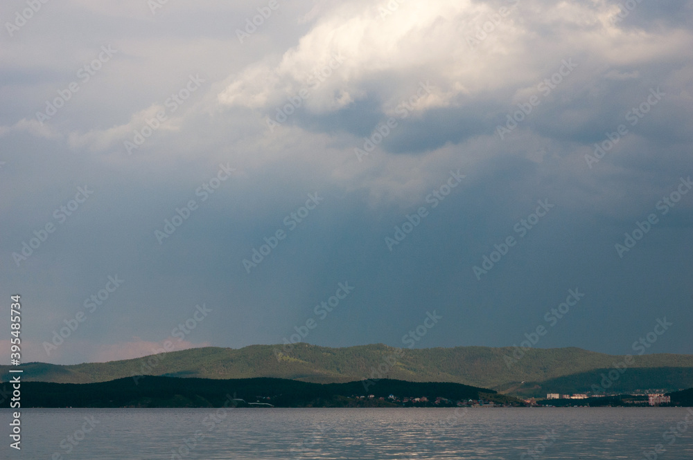 Rain clouds above hills on Turgoyak lake in Ural Rain clouds above hills on Turgoyak lake in Ural