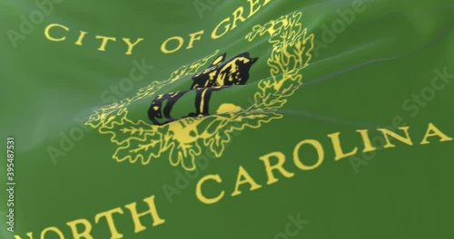 Flag of Greensboro city, state of North Carolina, United States, slow - loop photo