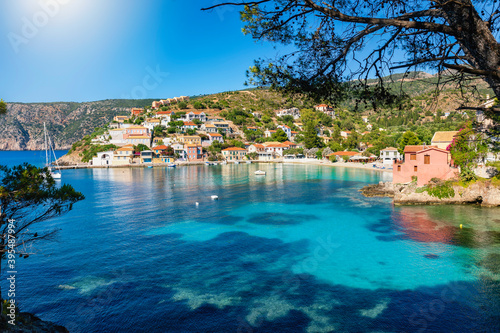 The picturesque village of Assos on the Ionian island of Kefalonia, Greece, with turquoise sea and green hills on a summer day
