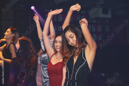 Group people Asian women dancing in night party, Happy new year party concert